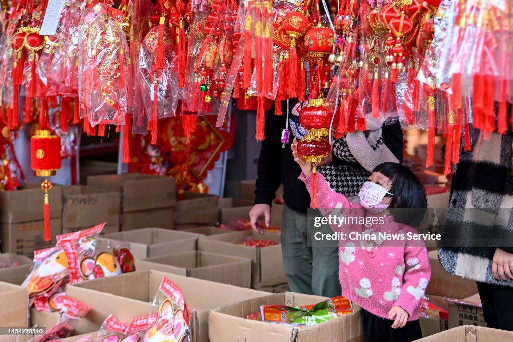 A Child Selects Spring Festival Decorations As 2023 Chinese Spring