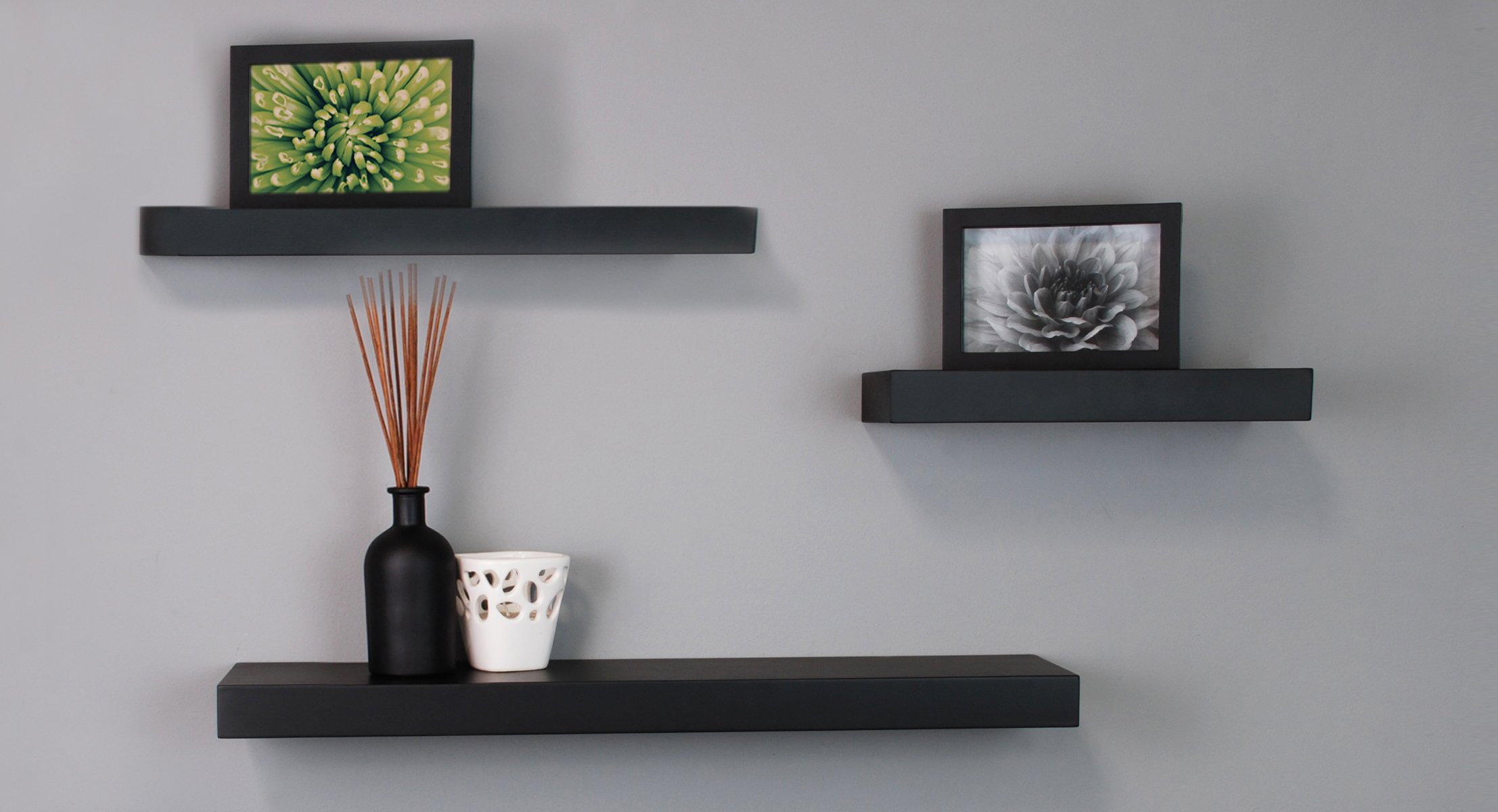 A Wooden Shelf With Black Metal Legs And Shelves On The Wall Next To A