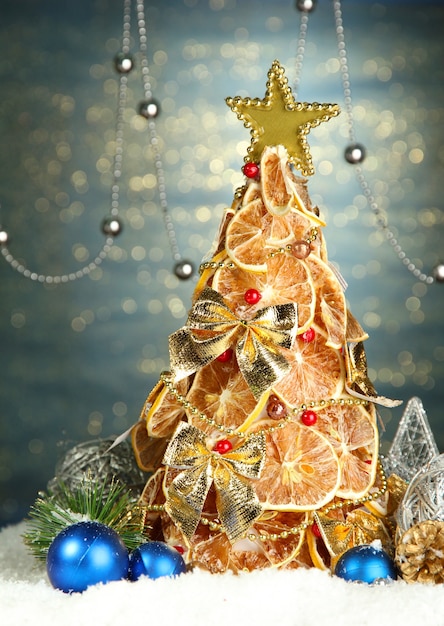 Beautiful Christmas Tree Of Dry Lemons With Decor On Shine Blue