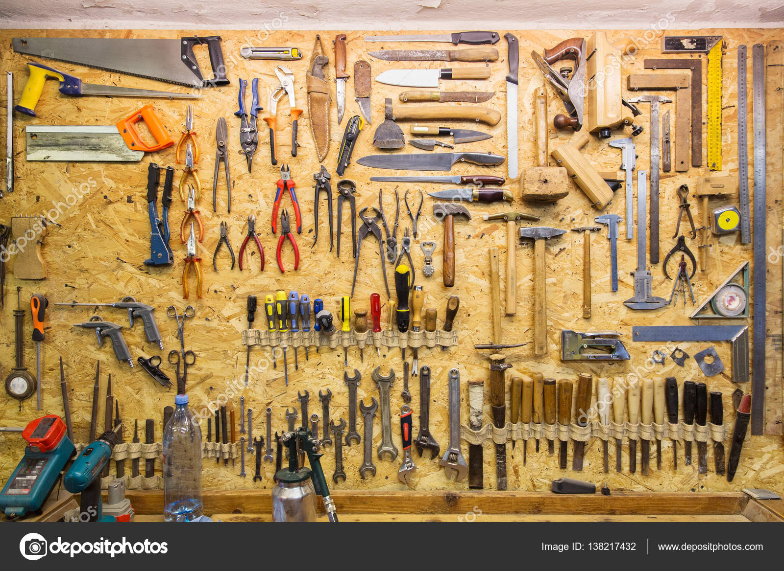 Work Tools Hanging On Wall At Workshop Stock Photo By Syda Productions 138217432